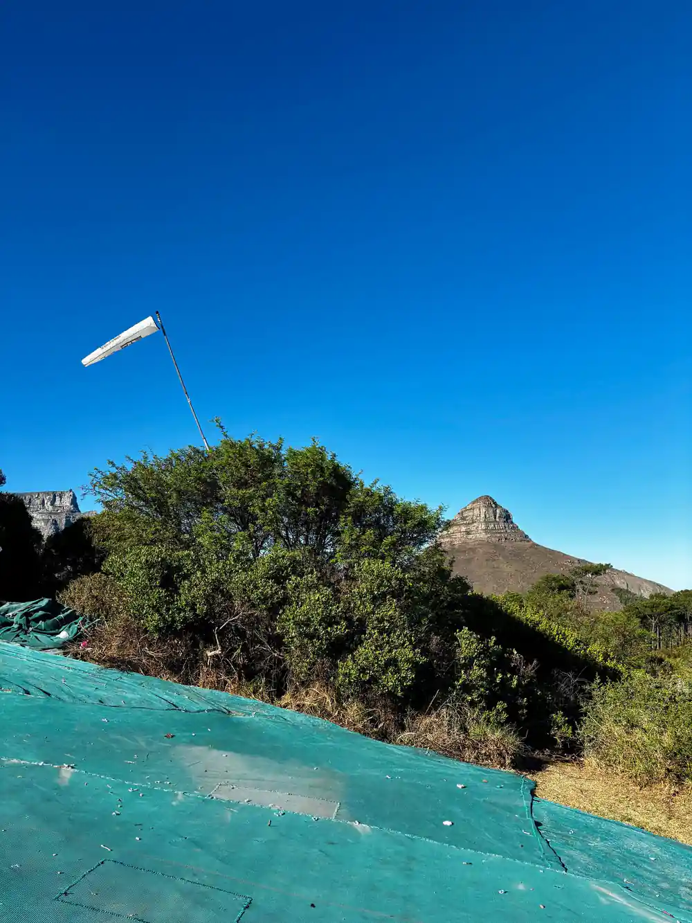 The launch slope with a windsock and Lion’s Head behind